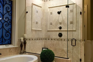 Bathroom - large traditional master beige tile, brown tile and ceramic tile travertine floor and beige floor bathroom idea in Cincinnati with recessed-panel cabinets, dark wood cabinets, beige walls, an undermount sink, granite countertops and a hinged shower door