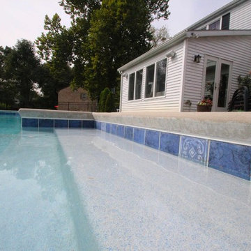 Classic Rectangle style in-ground salt water pool with diving board