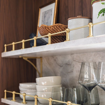Luxury Transitional Kitchen with Walnut Cabinetry, Marble Slab Backsplash & Bras