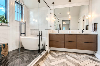Design ideas for a large contemporary master wet room bathroom in Denver with flat-panel cabinets, dark wood cabinets, a freestanding tub, white tile, ceramic tile, white walls, porcelain floors, an undermount sink, engineered quartz benchtops, beige floor, a hinged shower door, white benchtops, a double vanity, a floating vanity and vaulted.