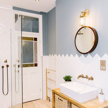 A rustic bathroom with a rolltop bath