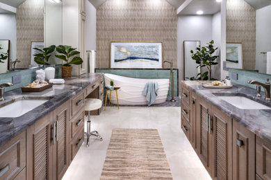 Island style master white tile and porcelain tile porcelain tile, white floor and double-sink bathroom photo in Oklahoma City with louvered cabinets, brown cabinets, a one-piece toilet, gray walls, an undermount sink, quartzite countertops, multicolored countertops and a floating vanity