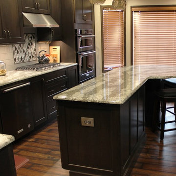 DuraSupreme Peppercorn Kitchen With Cambria Tops and Black Stainless Appliances