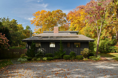 Example of a 1950s exterior home design in New York