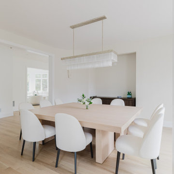 Formal Dining Room with Light Oak Floors and Custom Minimalist Decor
