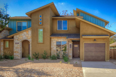 Inspiration for a small contemporary brown two-story mixed siding exterior home remodel in Austin
