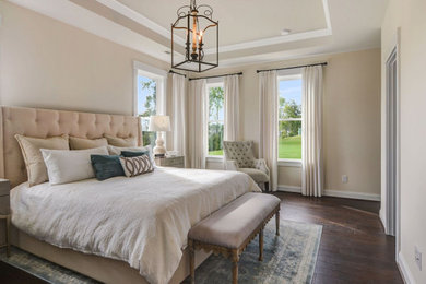 Design ideas for a large country master bedroom in Charlotte with grey walls, medium hardwood floors and brown floor.