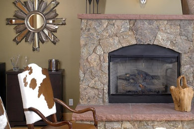 Design ideas for a mid-sized open concept family room in Denver with beige walls, light hardwood floors, a standard fireplace and a stone fireplace surround.