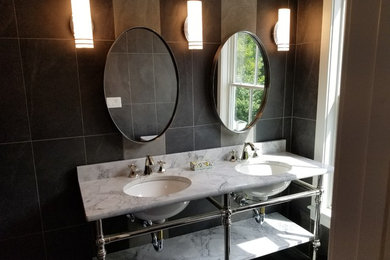 Bathroom - mid-sized contemporary 3/4 brown tile and ceramic tile bathroom idea in Other with open cabinets, brown walls, an undermount sink, marble countertops and white countertops