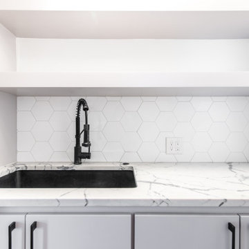 Wet Bar with Black Fixtures and Hardware for Commercial Office Space Remodel