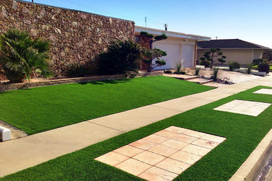 Photo of a transitional full sun stone landscaping in Orange County.