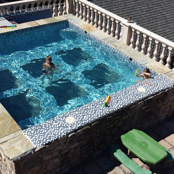 Tuscan style glass bottom rooftop pool