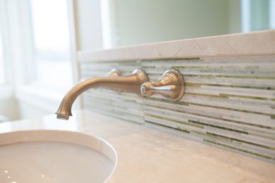 Bathroom - master multicolored tile and mosaic tile bathroom idea in Other with recessed-panel cabinets, dark wood cabinets, an undermount sink and a hinged shower door