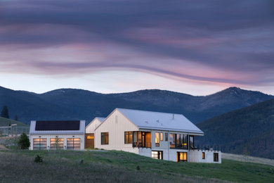 Modern white house exterior idea in Other with a white roof