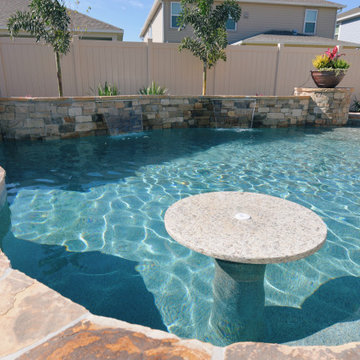 Custom Swimming Pool with Granite Tabletop and Spillway