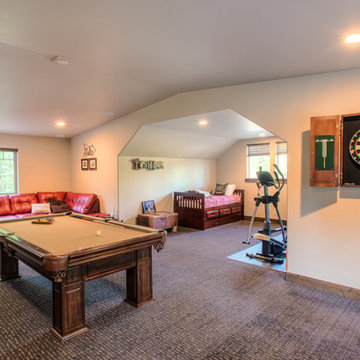 Family room with pool table and workout equipment
