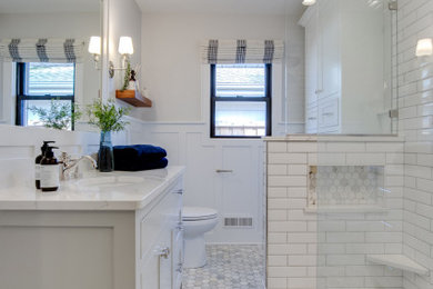 Example of a small minimalist 3/4 white tile and porcelain tile marble floor and white floor bathroom design in Minneapolis with flat-panel cabinets, gray cabinets, a two-piece toilet, gray walls, an undermount sink, quartz countertops and white countertops