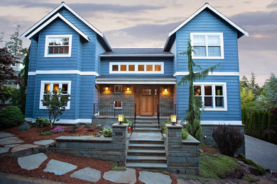 Example of a mid-sized classic blue two-story wood exterior home design in Seattle
