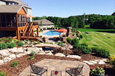 Design ideas for a transitional backyard water fountain landscape in Minneapolis.