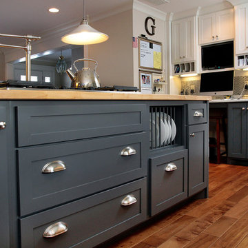 A chef's kitchen with cozy hearth room and spacious dining room