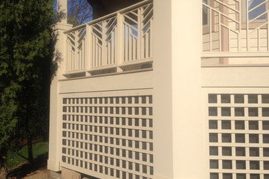 Large elegant back porch photo in Chicago with a roof extension