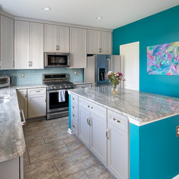 Gray Transitional Kitchen Cabinets with Complementary Gray Granite Countertops