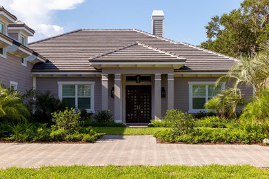 Example of a transitional exterior home design in Miami