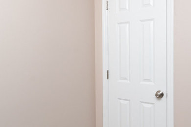 Ceramic tile and beige floor closet photo in Other