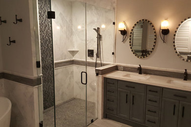 Inspiration for a mid-sized modern master white tile and metal tile porcelain tile and beige floor bathroom remodel in San Francisco with beige walls, an undermount sink, quartz countertops, a hinged shower door, beige countertops, recessed-panel cabinets and gray cabinets