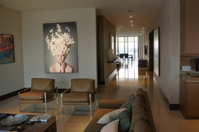Large trendy open concept limestone floor living room photo in Miami with beige walls, a ribbon fireplace, a wood fireplace surround and a wall-mounted tv
