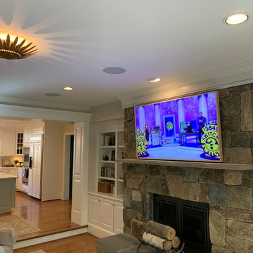 Samsung 65' FRAME Art Panel over Stone Fireplace with surround system
