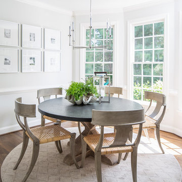 Light-Filled Dining Room with Round Table, Modern Chandelier & Gallery Wall