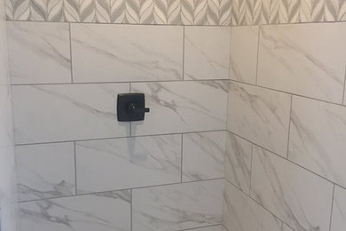 Mid-sized minimalist master white tile and porcelain tile dark wood floor and brown floor bathroom photo in Other with a one-piece toilet, white walls and a hinged shower door