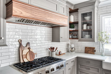 Kitchen - transitional kitchen idea in New York with porcelain backsplash