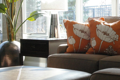 Mid-sized transitional open concept carpeted family room photo in Other with a wall-mounted tv and gray walls