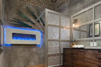 Bathroom - industrial medium tone wood floor bathroom idea in Other with an integrated sink, furniture-like cabinets, dark wood cabinets, wood countertops, a two-piece toilet and gray walls