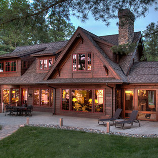 Example of a mountain style brown one-story wood exterior home design in Minneapolis with a shingle roof