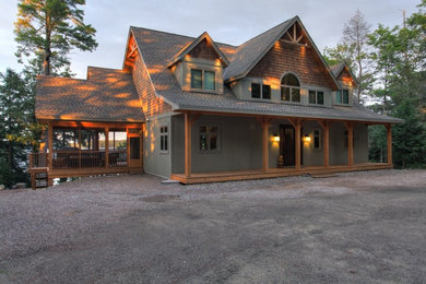 Example of a large arts and crafts gray two-story wood exterior home design in Toronto