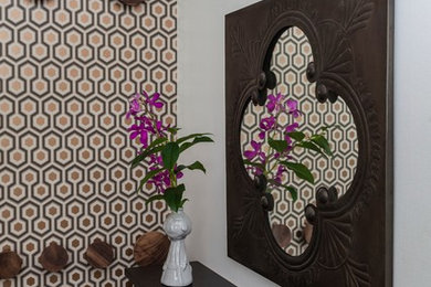 Inspiration for a small transitional medium tone wood floor entryway remodel in New York with a white front door