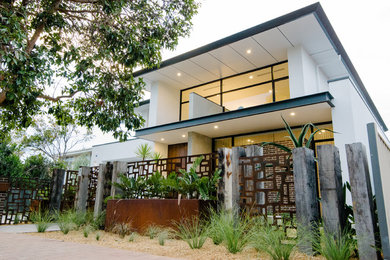 This is an example of a large contemporary two-storey white exterior in Adelaide.