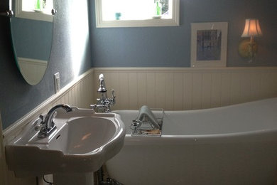 Example of a mid-sized classic 3/4 white tile and porcelain tile porcelain tile bathroom design in Other with a pedestal sink, a two-piece toilet and blue walls