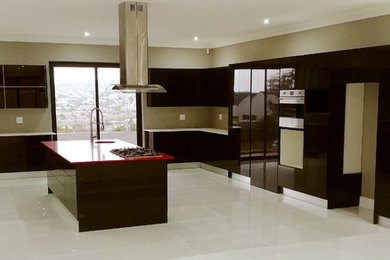 Home design - large modern home design idea in Other