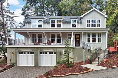 Large cottage gray three-story mixed siding exterior home photo in Other with a shingle roof