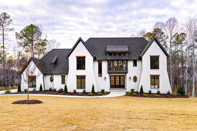 Example of a transitional home design design in Raleigh
