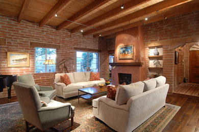 Inspiration for a mid-sized southwestern open concept dark wood floor living room remodel in Phoenix with a music area, a standard fireplace and red walls