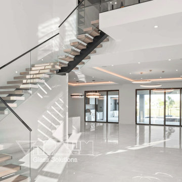 Floating staircase with glass railings