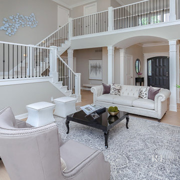 Living Room with Grand Staircase and Catwalk