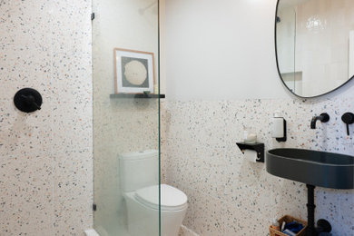 Bathroom - mid-sized 3/4 single-sink bathroom idea in Los Angeles with black cabinets and a floating vanity