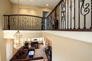 Inspiration for a mid-sized timeless dark wood floor hallway remodel in Los Angeles with beige walls