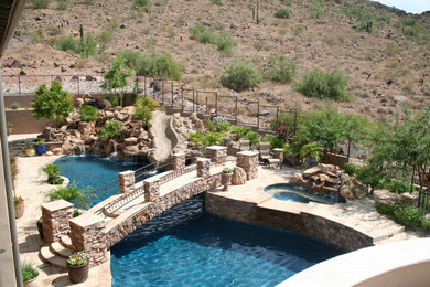 Island style pool photo in Phoenix